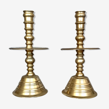 Pair of bronze church candle holders