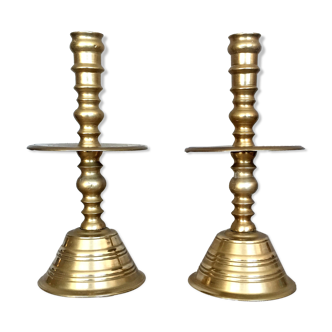 Pair of bronze church candle holders