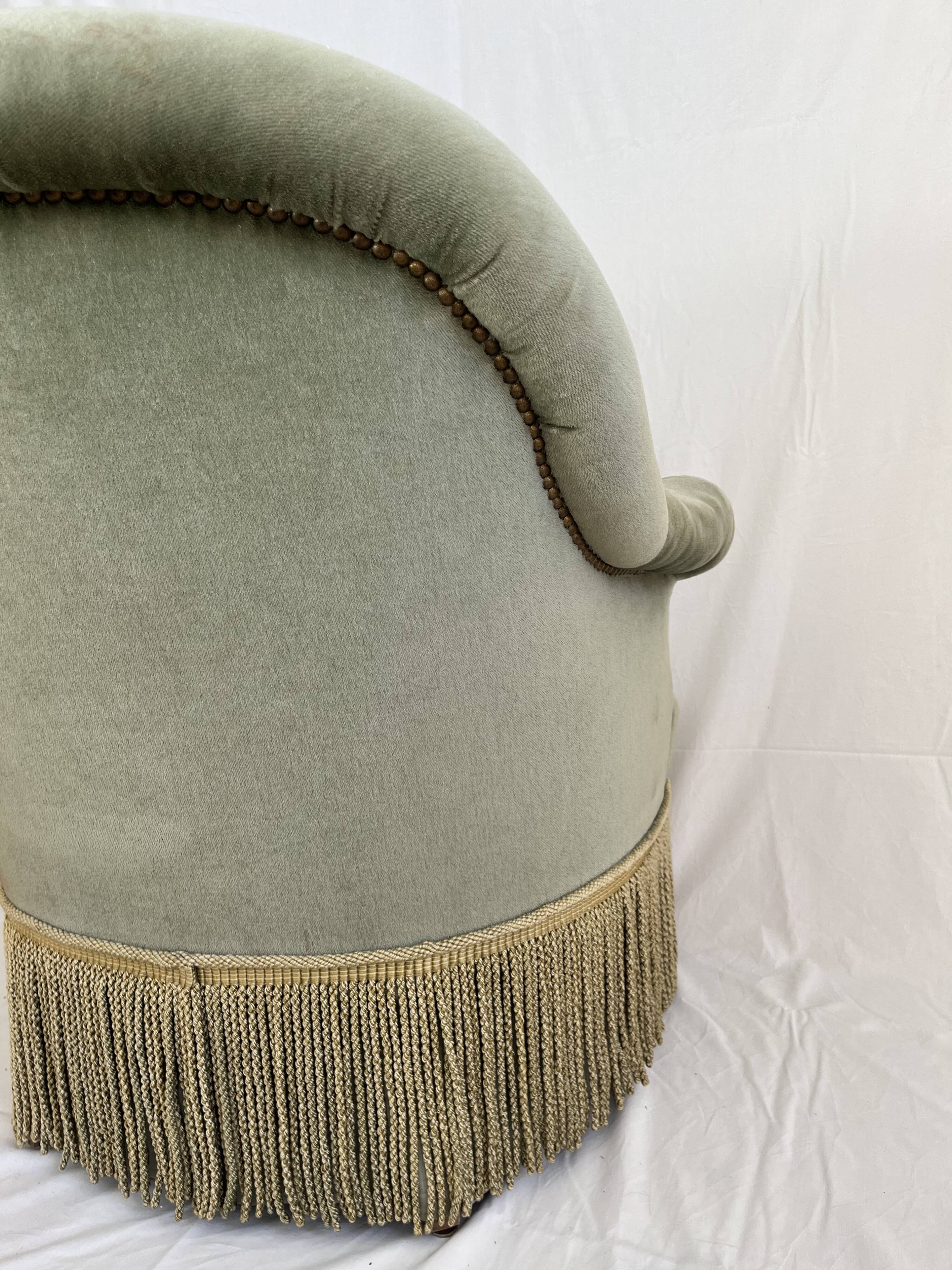 sage green toad armchairs with gold fringe