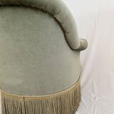 sage green toad armchairs with gold fringe