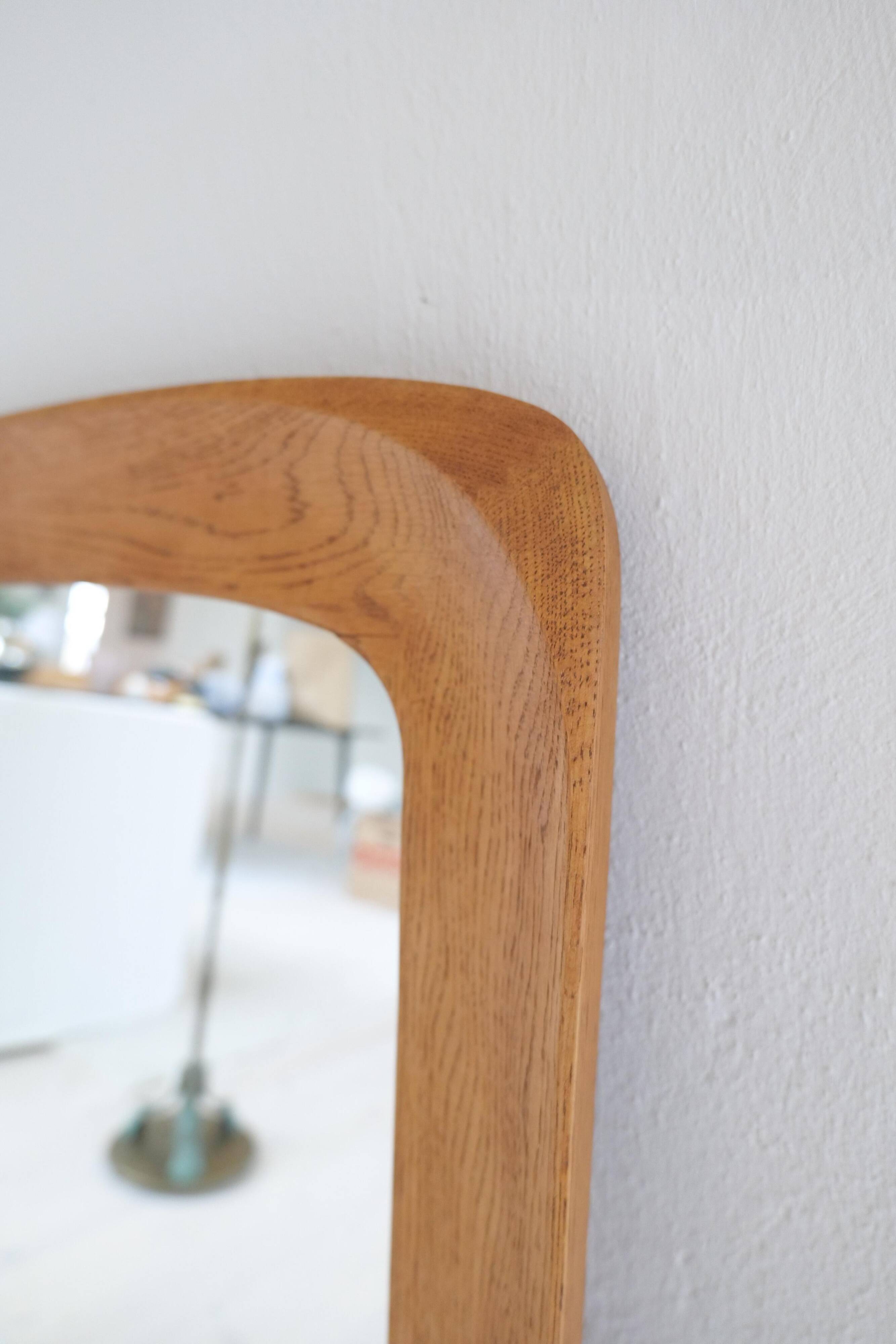 Mid-century modern sculptural wall mirror in stained oak, glass, Glas & Trä 1959