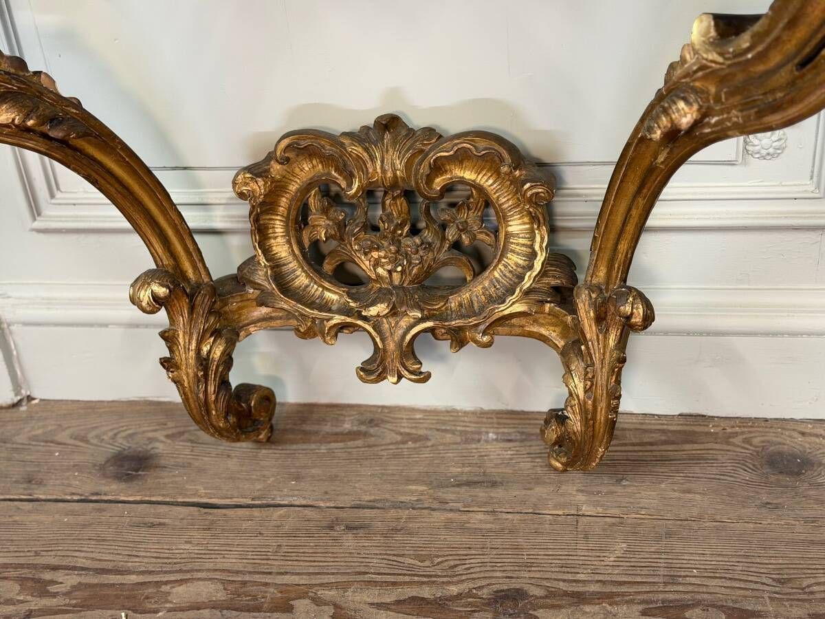 Louis XV style console in carved and gilded wood, circa 1880.