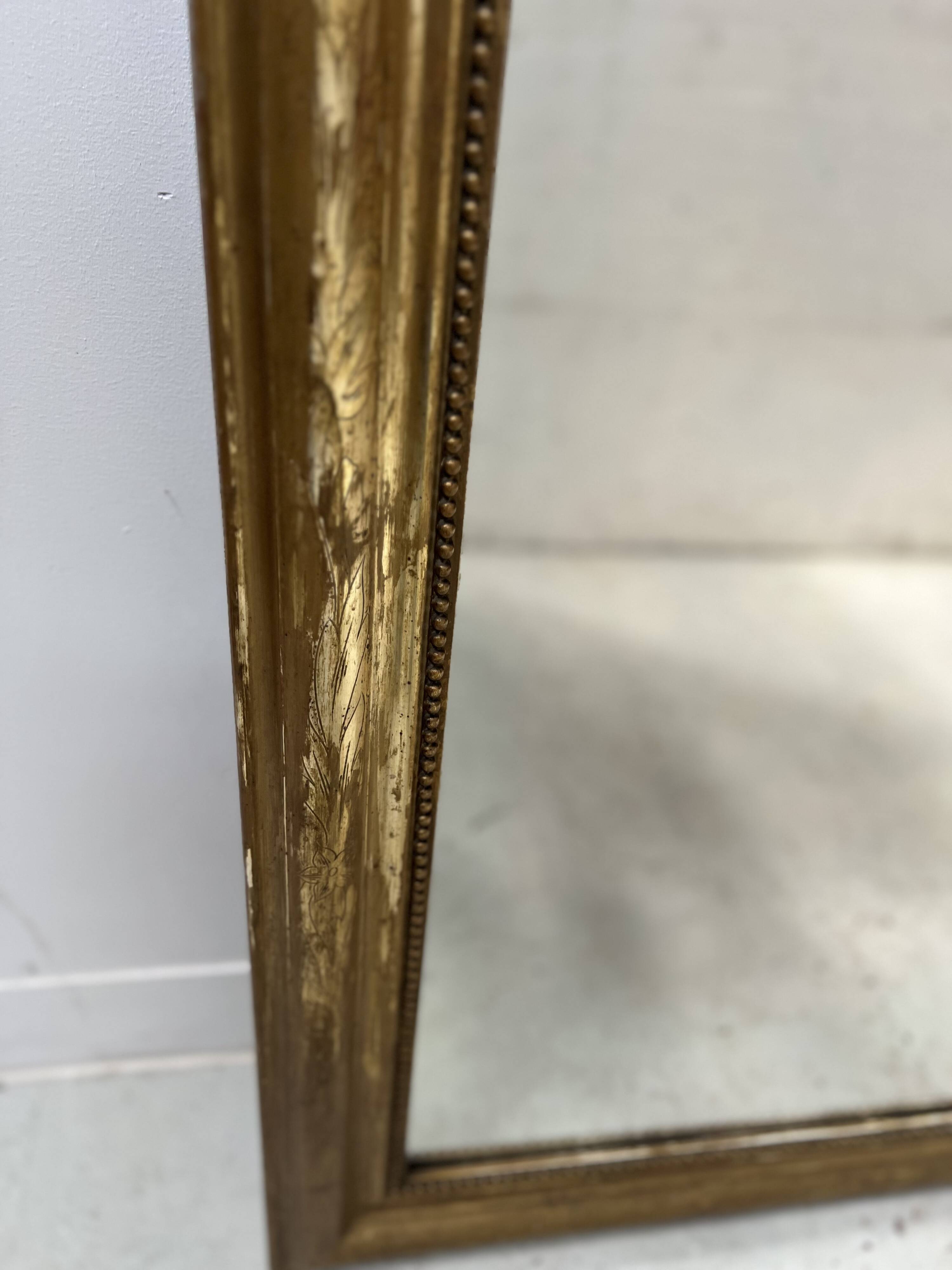 Louis Philippe mirror in wood and gilded stucco, 19th century