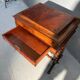 Antique wooden sewing table with drawer.