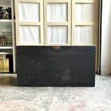 Trunk, black wooden chest and wallpaper