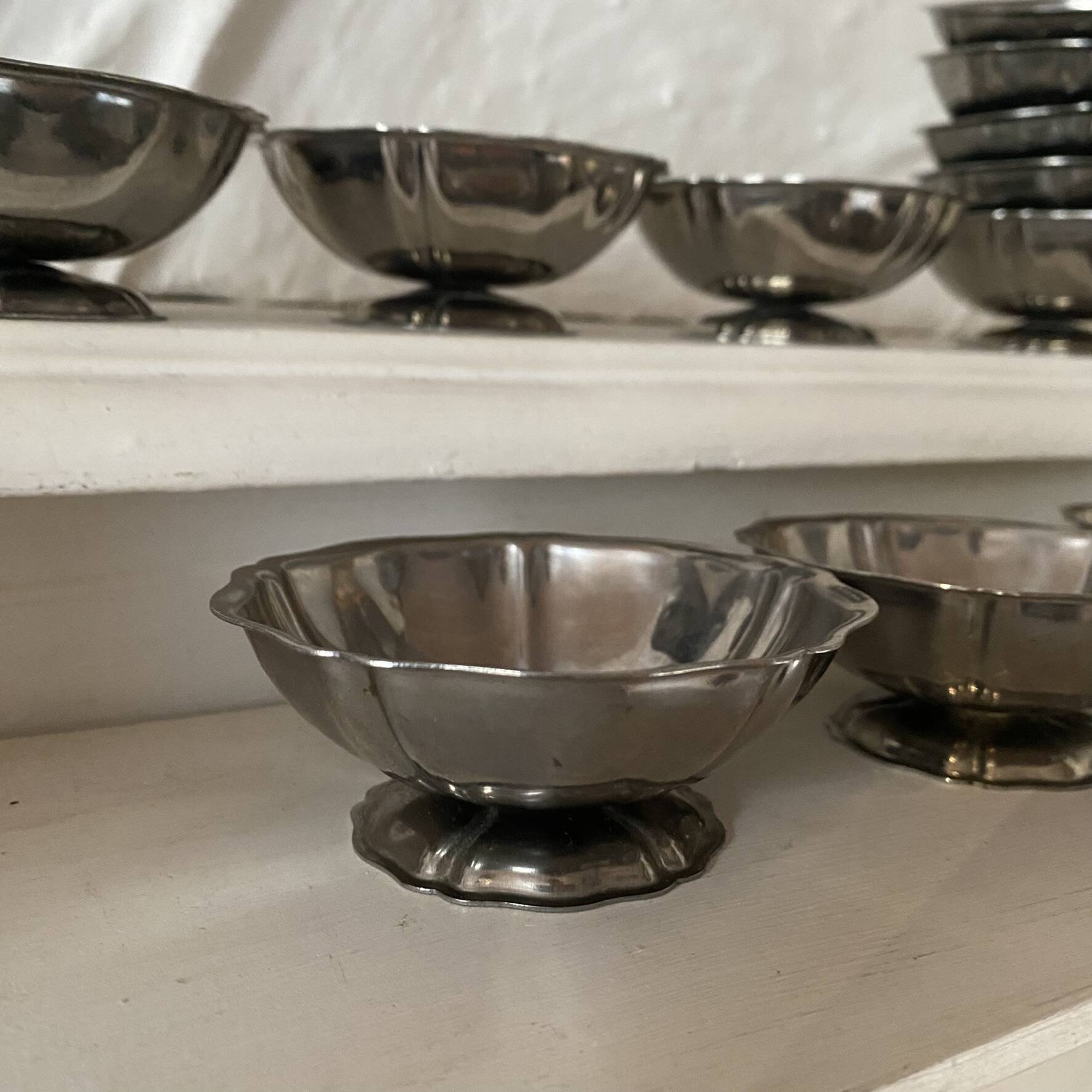 Stainless steel ice cream bowls for one scoop.