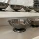 Stainless steel ice cream bowls for one scoop.