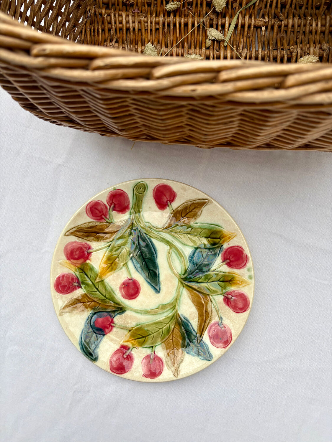 Very old barbotine plate with cherries
