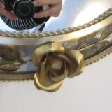 Round gilded metal mirror, crown of roses