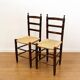 Pair of antique rush-seated chairs in solid wood – France, mid-20th century