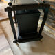 Renovated vintage bar cart in black and copper with removable serving tray.