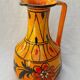 Orange ceramic jug