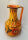 Orange ceramic jug