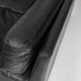 Black leather two-seater sofa. Roche Bobois edition. France, 1980s.