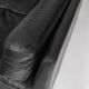 Black leather two-seater sofa. Roche Bobois edition. France, 1980s.