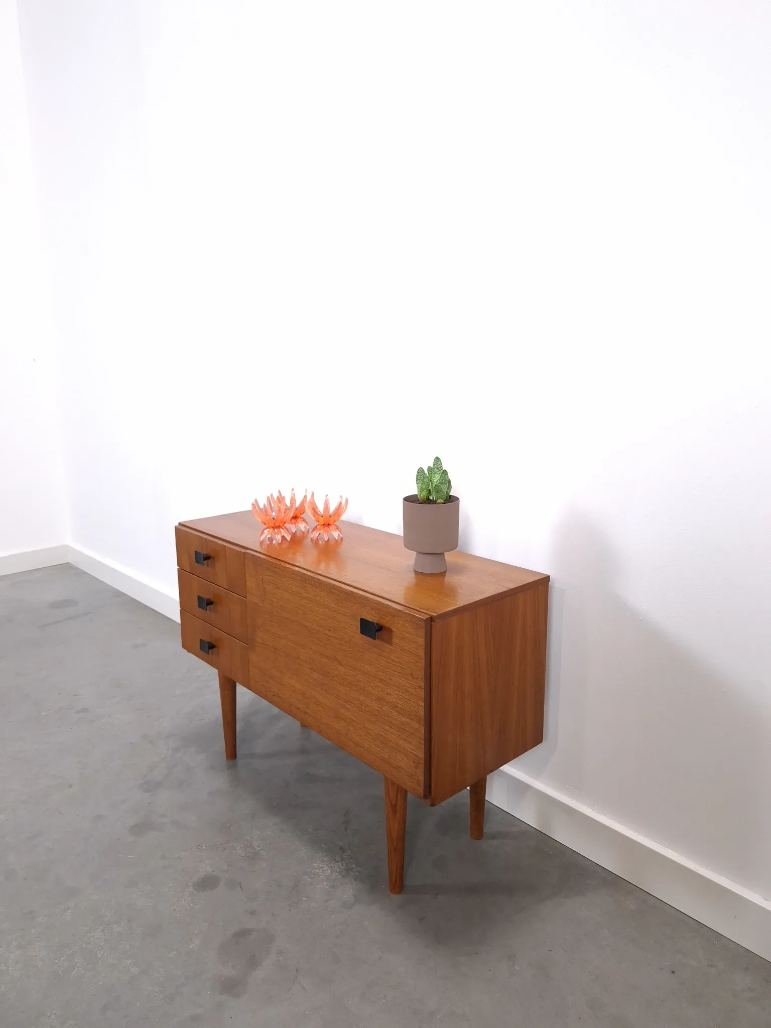 Vintage small teak cabinet with drawers, flap and black handles, hallway cabinet.