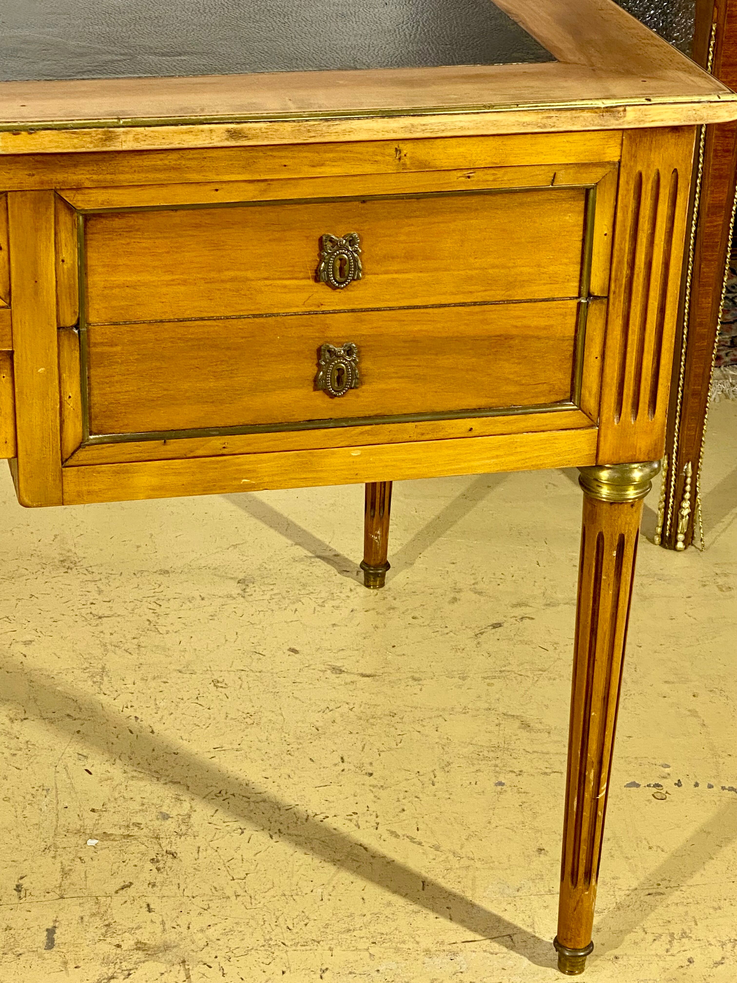 Louis XVI style desk in walnut veneer and brass fillets