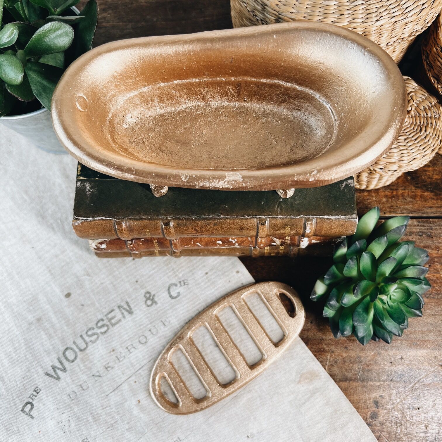 Cast iron soap dish in the shape of a bathtub