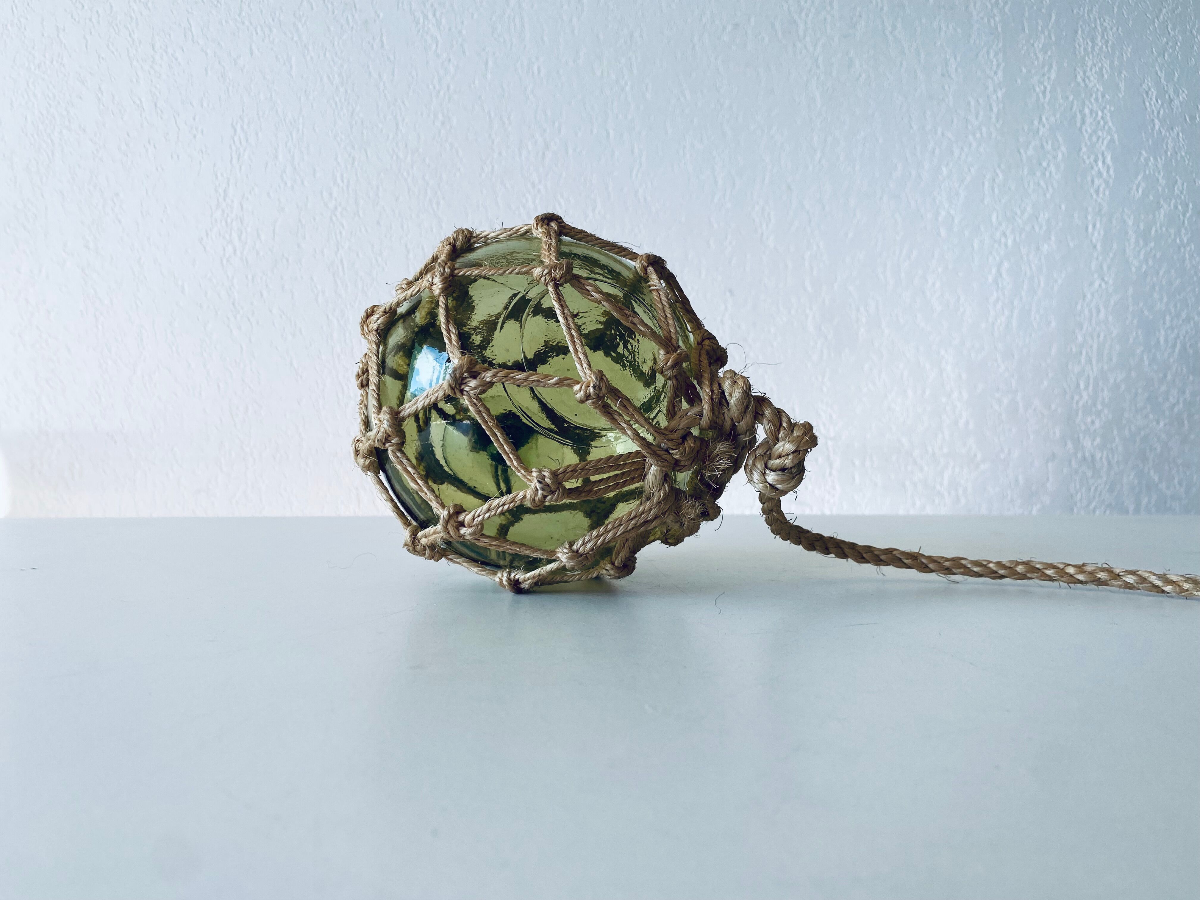 Antique fisherman's ball, old fishing floats