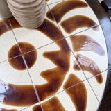 Round ceramic coffee table with “rooster” motif by Dan