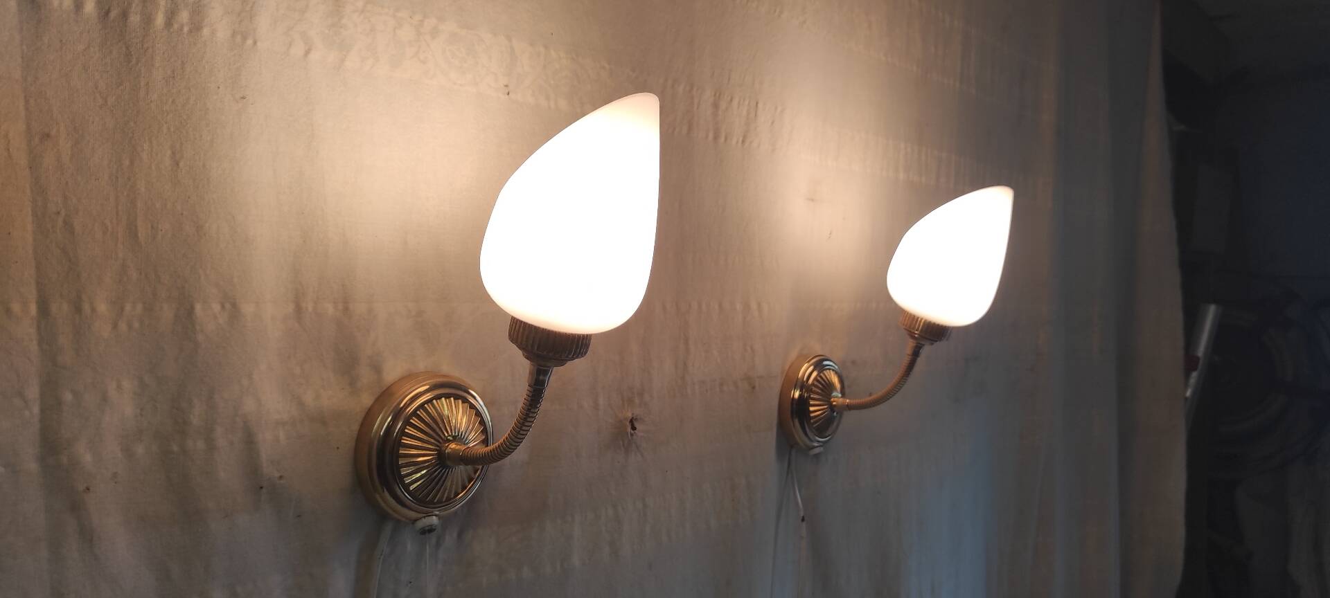 Articulated brass and opaline wall lights - mid 20th century.