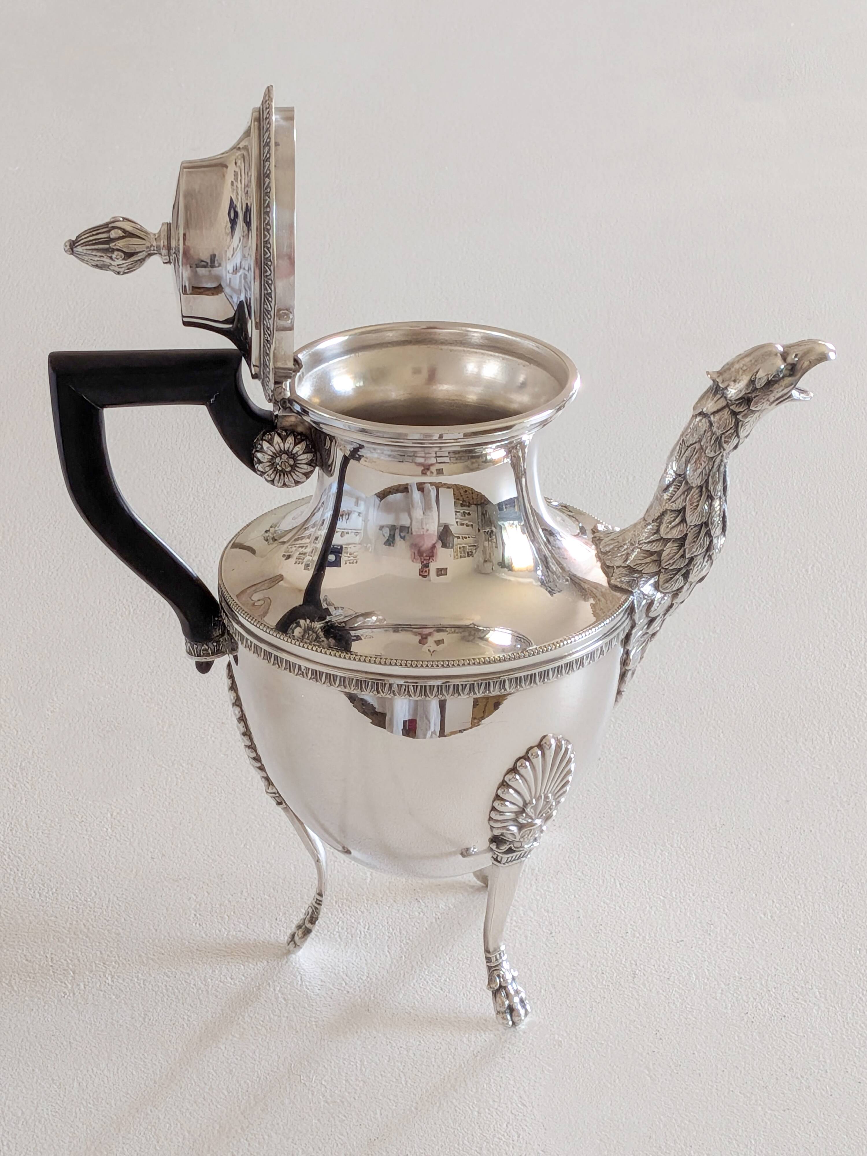 Empire-style silver-plated coffee pot with eagle head spout.