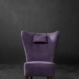 High-backed wing chair in oak and purple fabric, vintage Scandinavian style from the 1950s.
