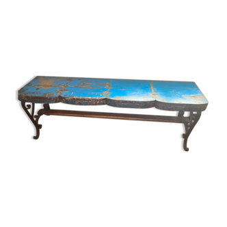 Wooden bench and vintage colored wrought iron