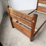 Brutalist style bed with chain and straw