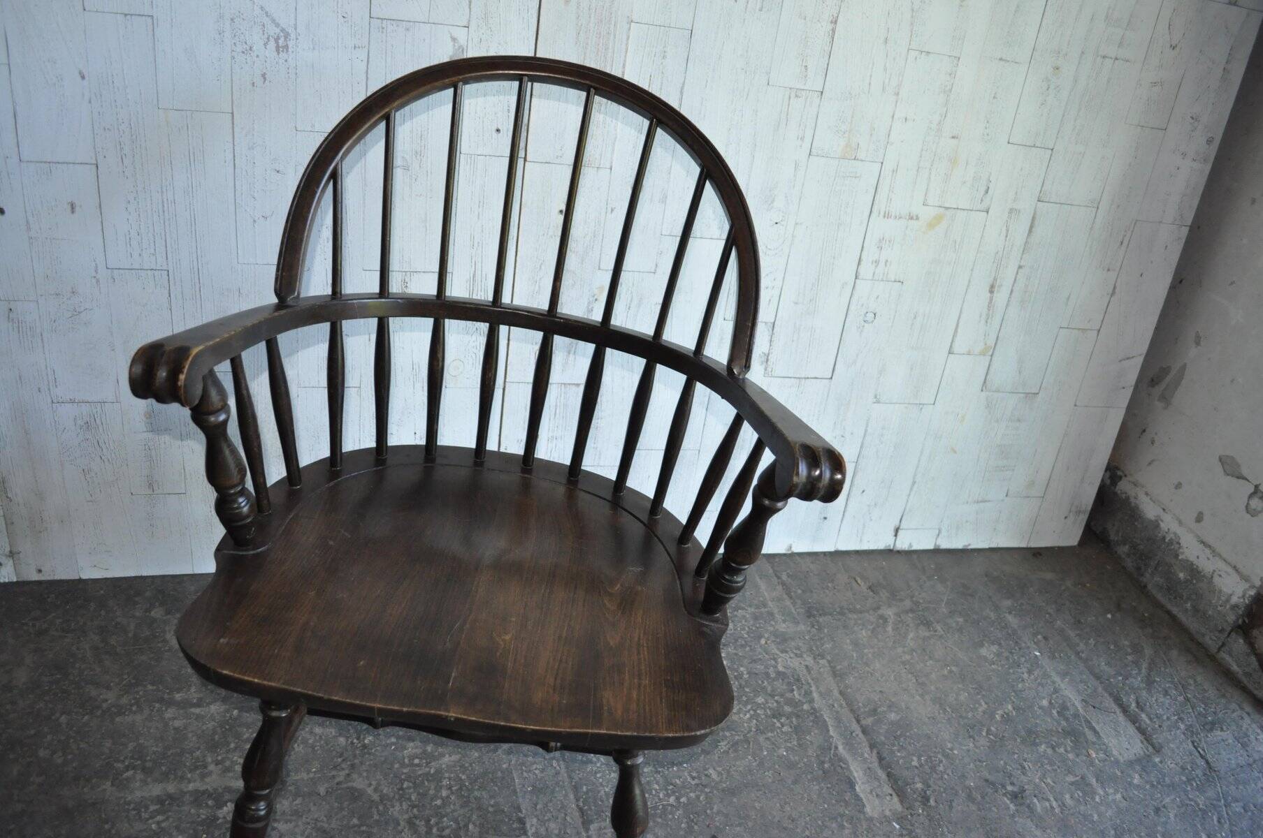 Brown wooden Windsor chair, 19th century — slatted backrest and carved seat