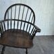 Brown wooden Windsor chair, 19th century — slatted backrest and carved seat