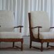 Modern Danish design, a pair of high-backed armchairs in oak and lambswool, 1950s.