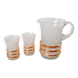 set composed of a pitcher and two large white granite glasses with gold edging from the 60s