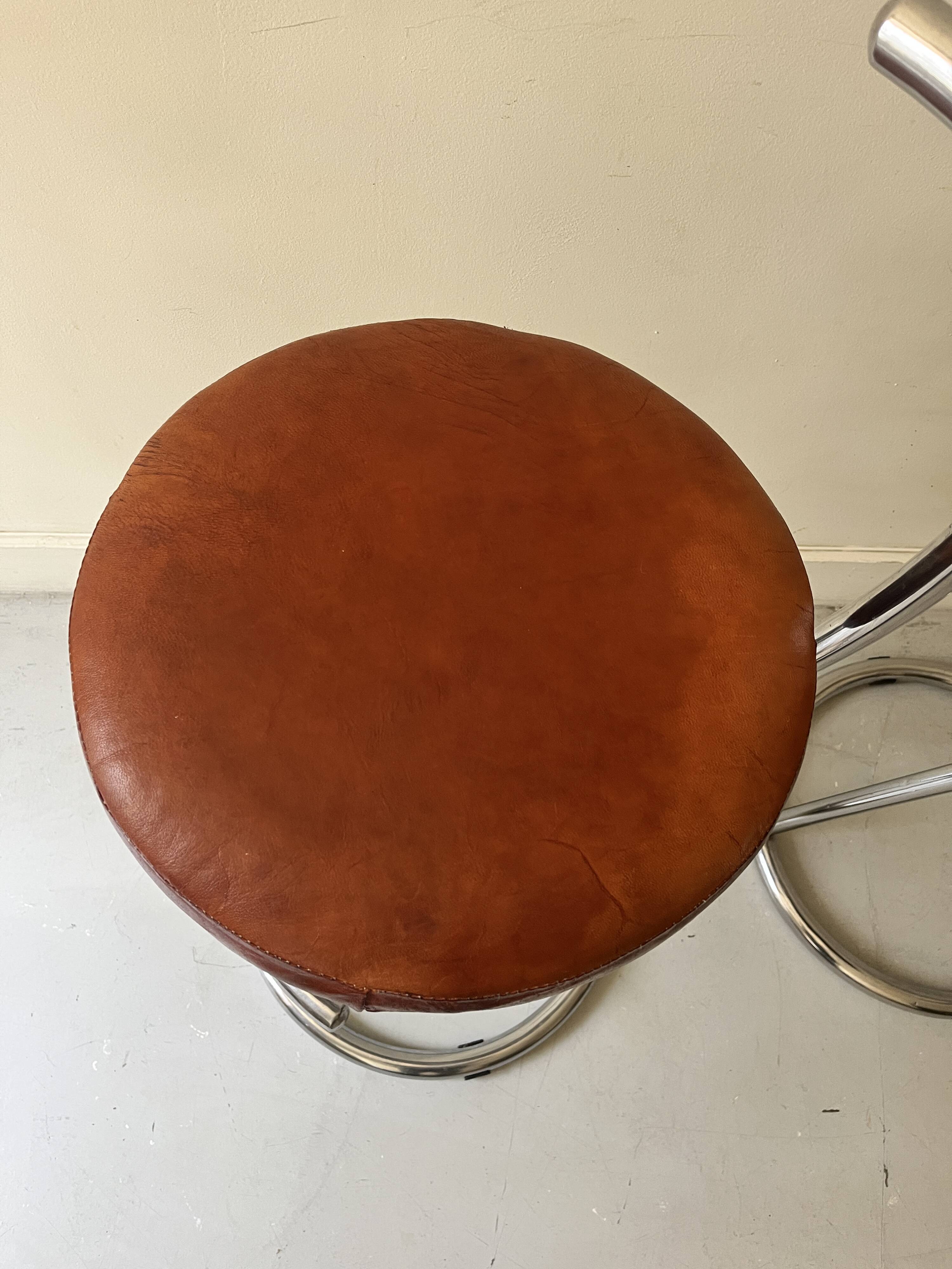 Bar stools in tubular chrome and tan leather, 1970s