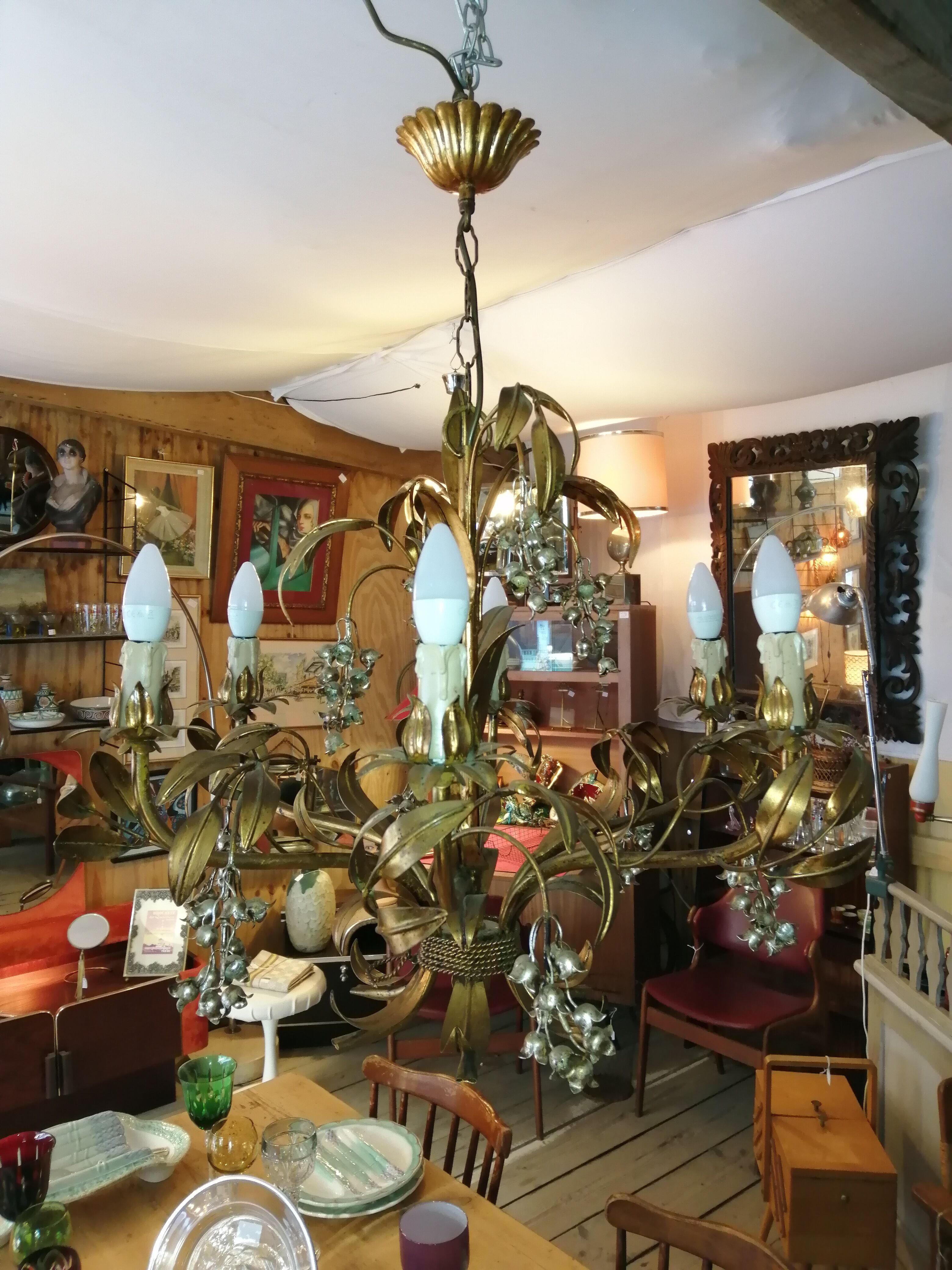 Gilded brass chandelier and silver lily of the valley bells