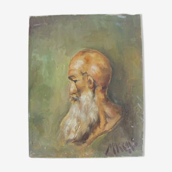 Portrait of a bald man with a long white beard