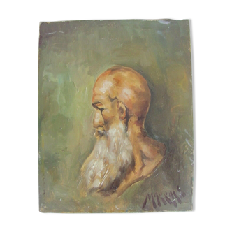 Portrait of a bald man with a long white beard