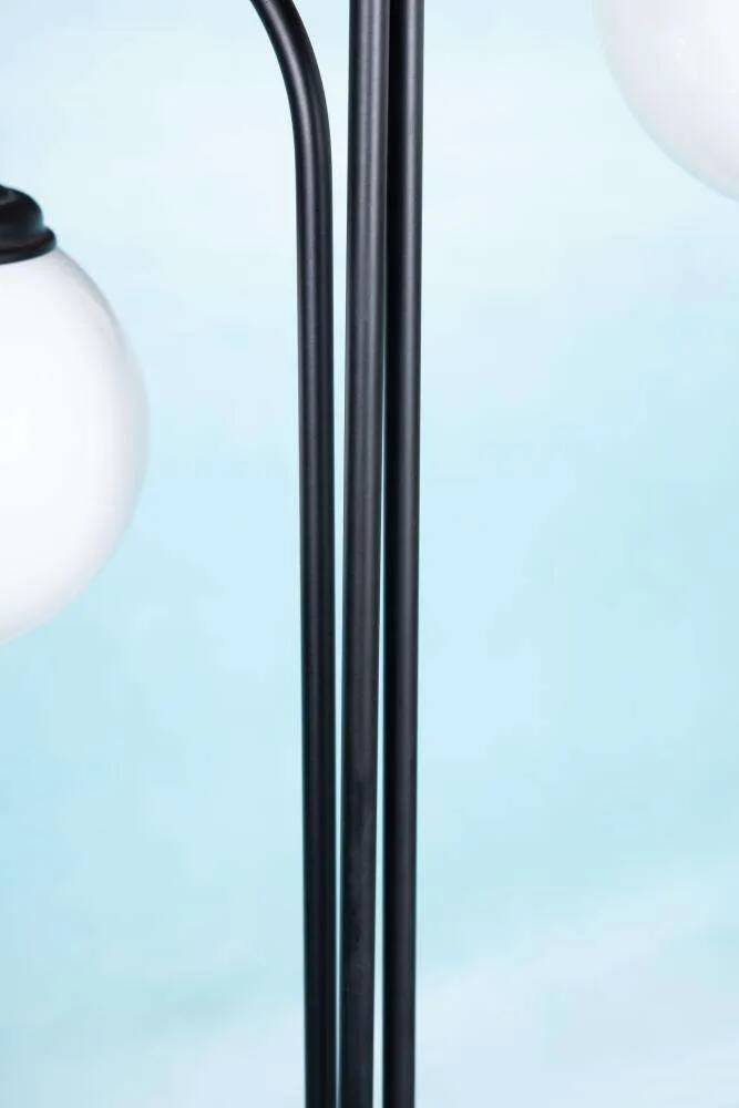 Minimalist floor lamp in glass, space age style.