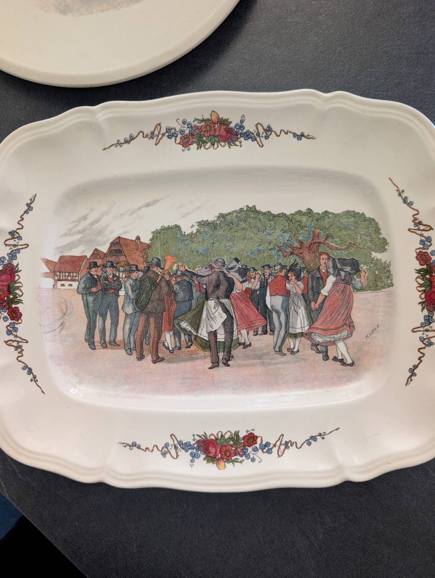 Two earthenware dishes from Obernai signed Henri Loux.