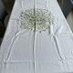 Hand-embroidered tablecloth on rectangular thread canvas