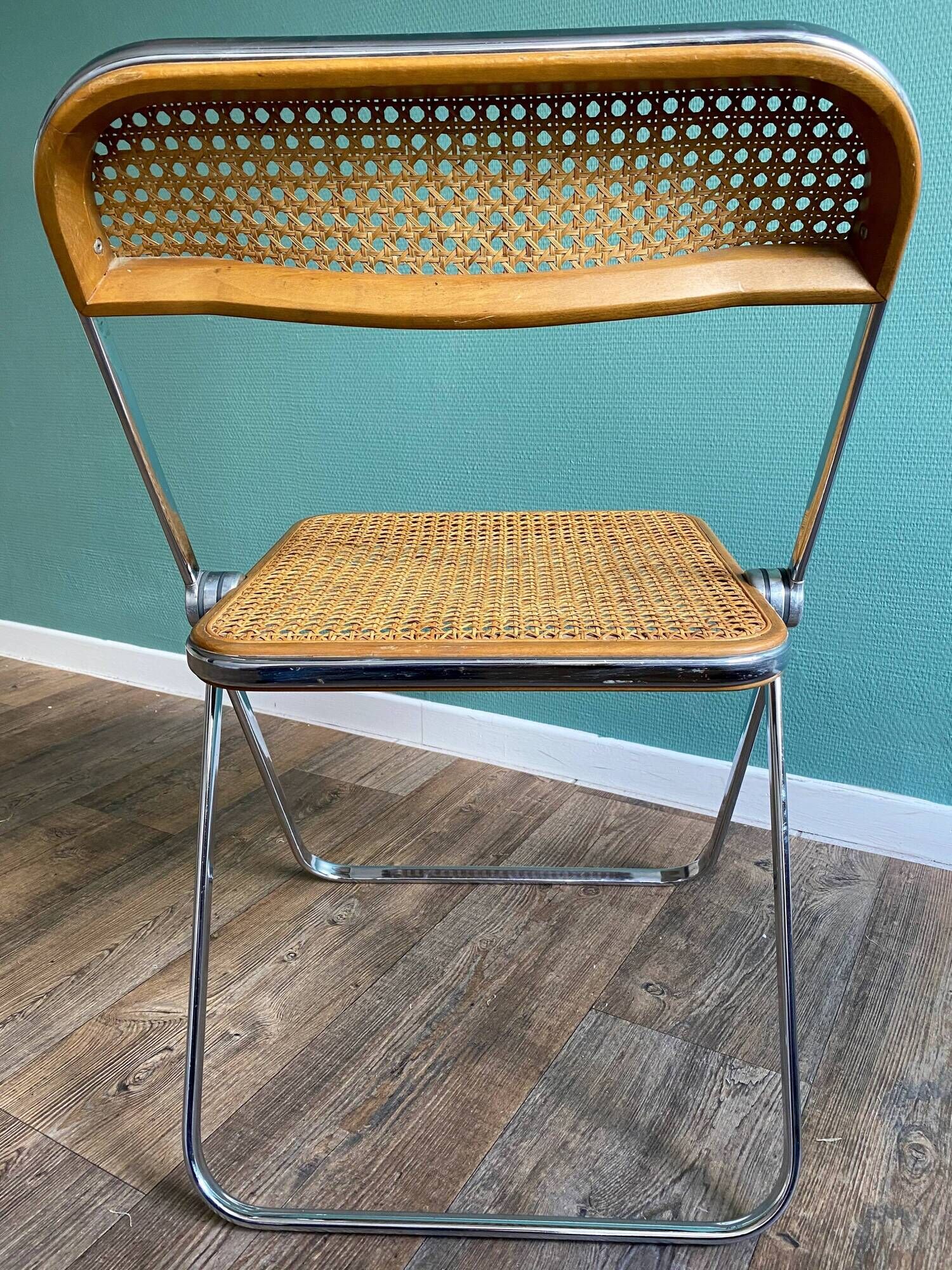 Wooden and caning folding chair "Plia" by G. Piretti for Castelli editions