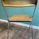 Wooden and caning folding chair "Plia" by G. Piretti for Castelli editions