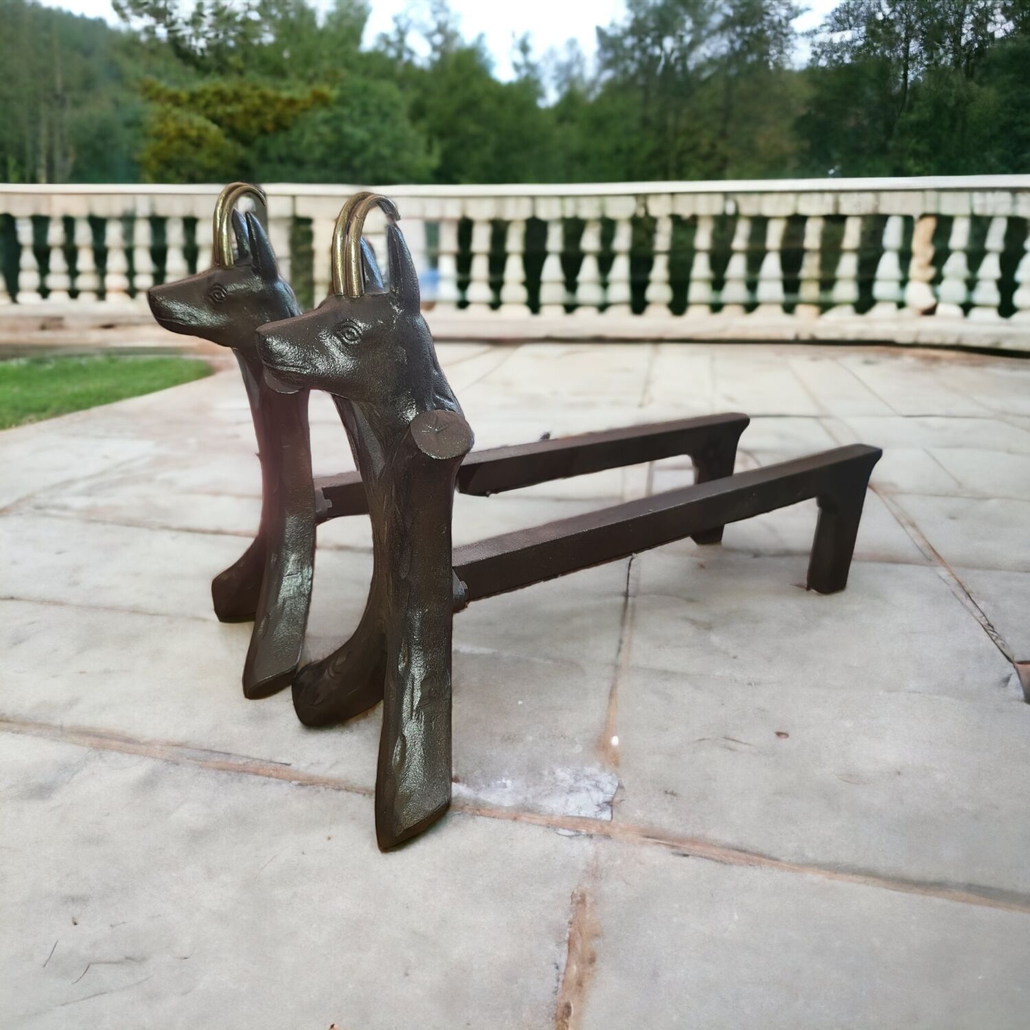 Zoomorphic buff brass and cast iron andirons