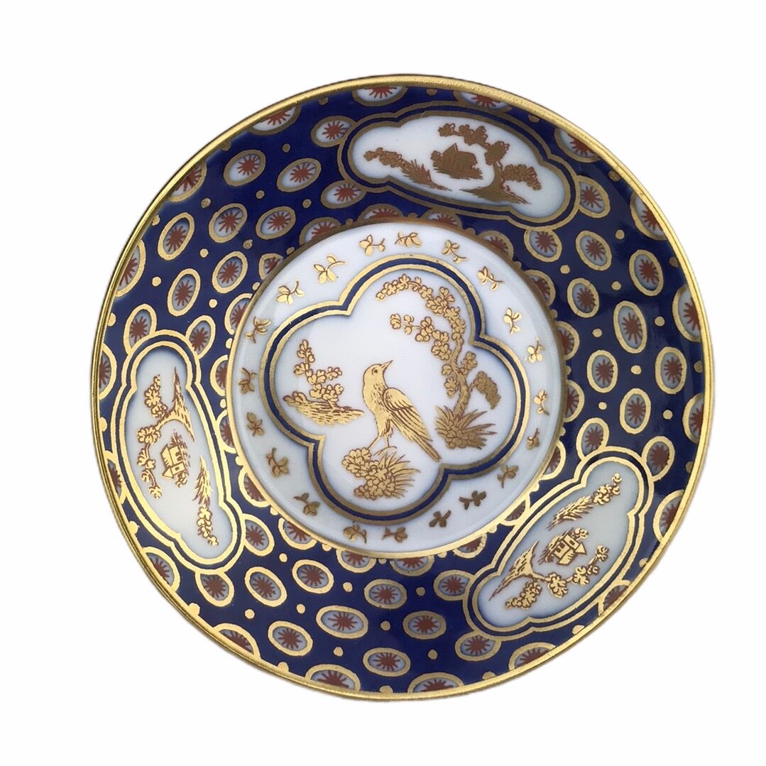 Paire de tasses Bernardaud aux oiseaux