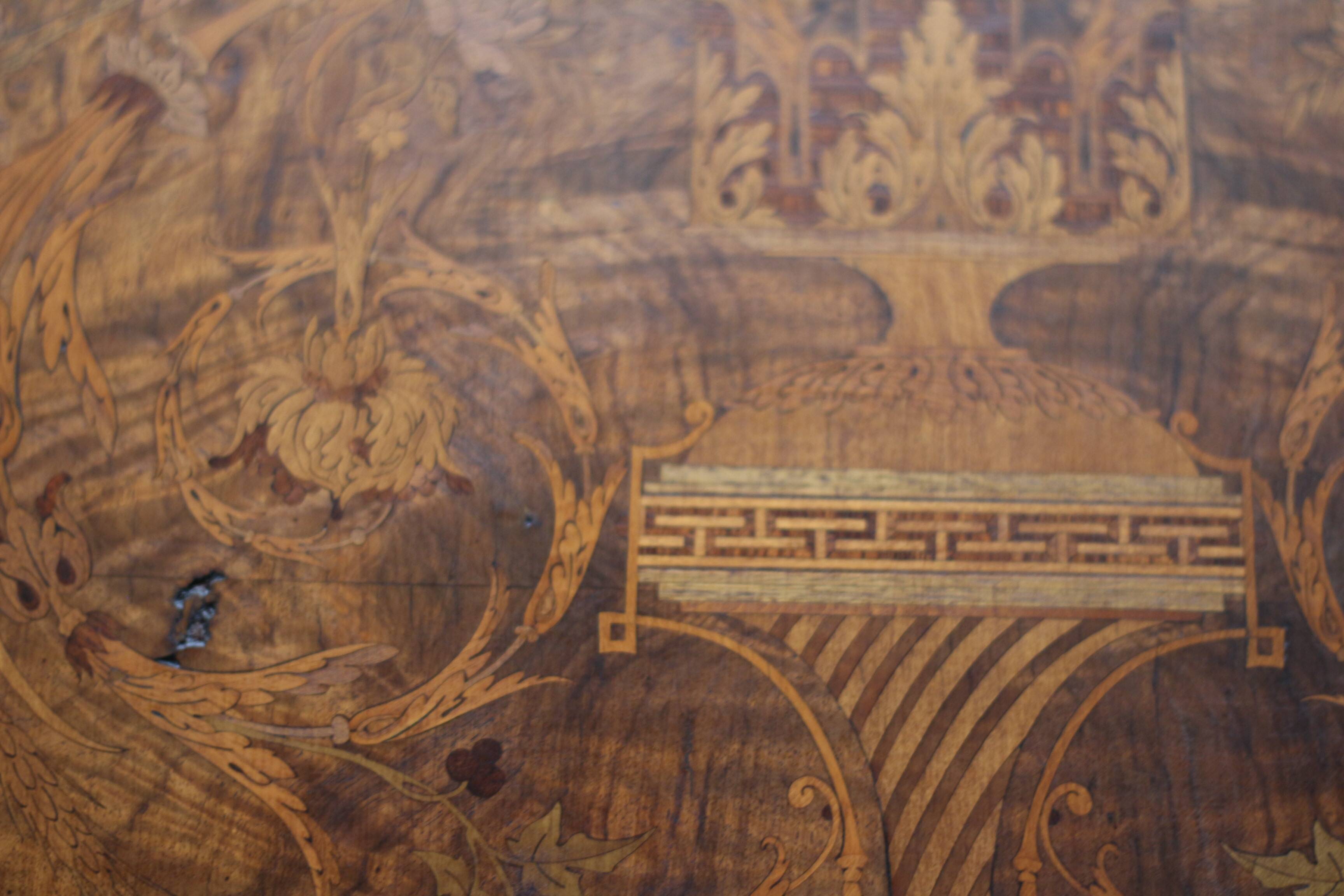 Superb Napoleon III table. Marquetry top and gilded bronzes.