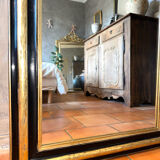 Louis-Philippe mirror in black and silver, 19th century.