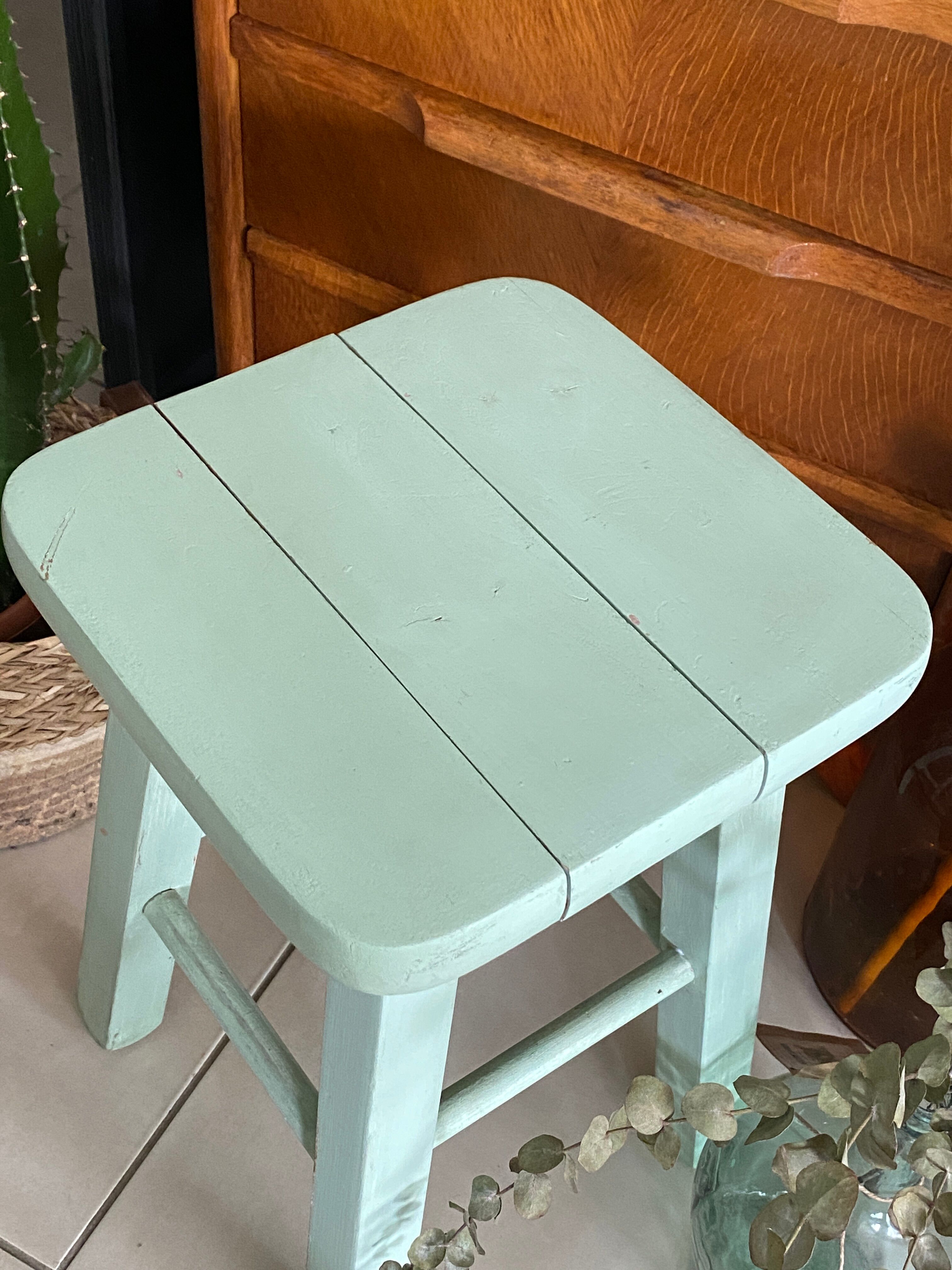 Old almond green wooden stool