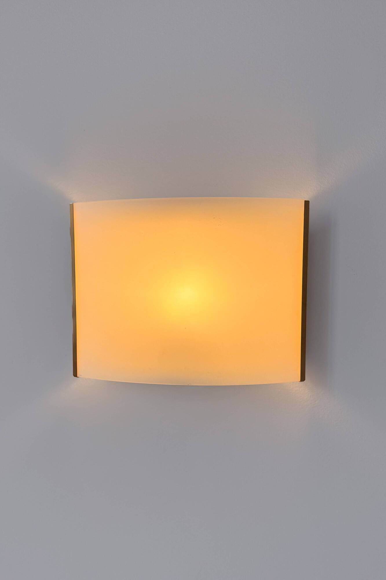 Pair of vintage brass and curved glass wall lights, France, 1970.
