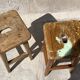 Pair of vintage wooden workshop stools with a patina.