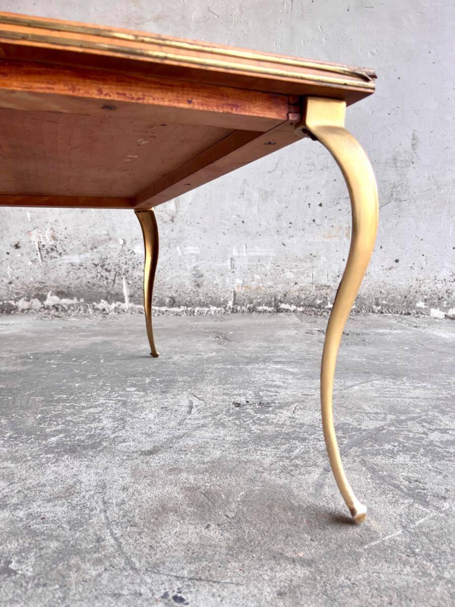 Mid-century wooden coffee table with golden metal legs and black-lined tabletop, 1950s